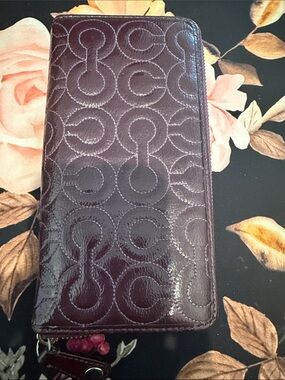 Coach Embossed Circle Pattern Zip Wallet - Deep Plum